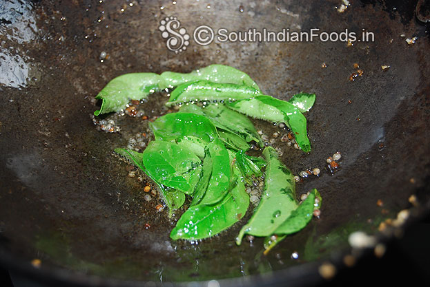 Heat oil in a pan seasoning with mustard seeds and curry leaves