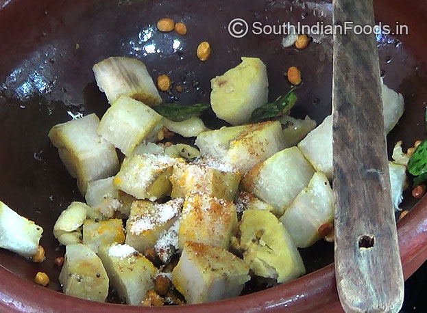 Add Boiled raw banana cubes, salt, turmeric & red chilli powder