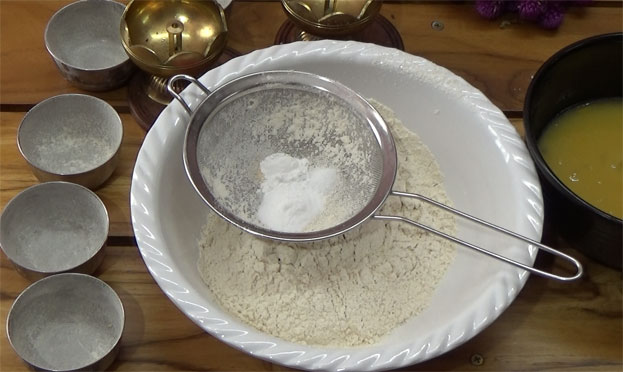 Add salt, baking powder & baking soda, seive without lumps